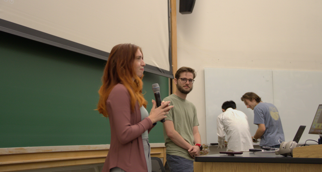 JILA graduate student Anya Grafov (left) introduces graduate student speaker Jeremy Thurston for the inaugural JAGS Seminar Series. 