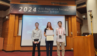 JILA graduate student Anya Grafov stands with her best poster award at the IEEE Magnetics Society Summer School in Taiwan