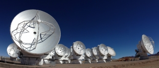 Photograph of ALMA’s 16-antenna Atacama Compact Array.