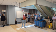 JILA and NIST Fellow and University of Colorado Boulder Physics professor Eric Cornell explains the science of the summer solstice to onlookers in the X-wing basement. 