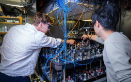 JILA researchers Lukin Yelin and Cao in the Kaufman lab at JILA. (Credit: Patrick Campbell/CU Boulder)