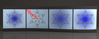 A film reel of 4 frames shows an artist's depiction of atoms in a start shape being blasted by a laser and then responding
